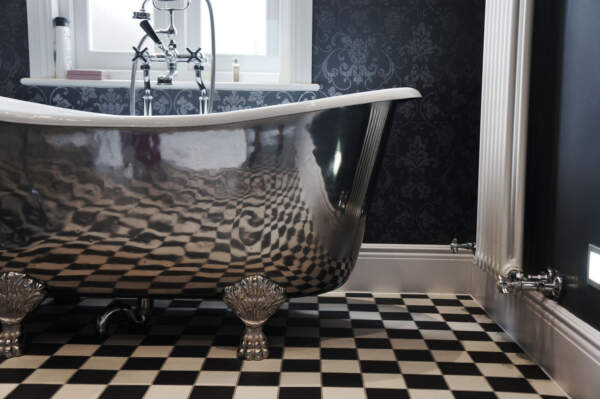 luxury traditional bathroom, stainless steel bathtub, black & white Victorian tiles, Sanitary ware, ironmongery, Lefroy Brookes.