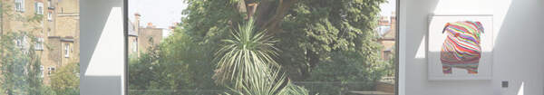 Architecture:WK, Architectural services: view into a patio, a green oasis with palmtrees in the city.