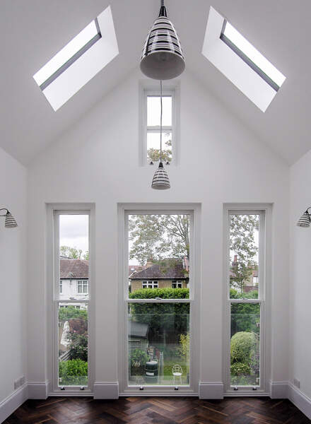 A small project extentsion - view of a roof changed to a pitche one with slimline skylights, open to the rafters to give a sense of height and space.