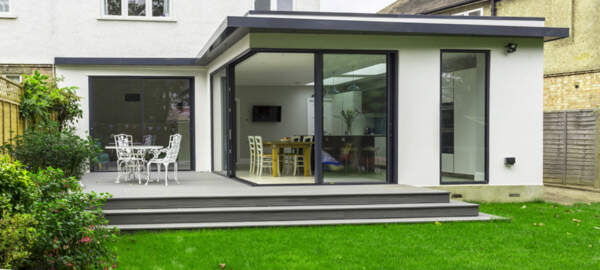 Rendered Extension, corner glazing and sliding doors,