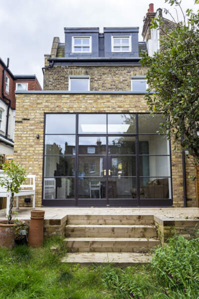 brick extension, steel framed glass wall. Gorgeous, simple design