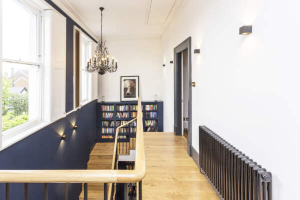 Elegant Homes - Gorgeous staircase with cantilevered landing, changing an pokey stair into a grand entrance hall