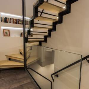 plywood stair with glass balustrade